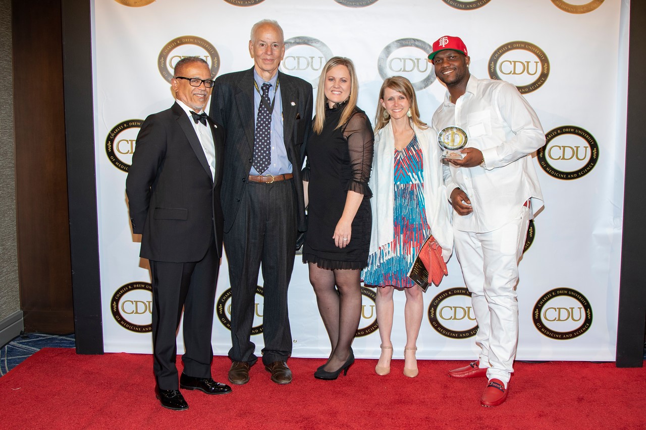 Pictured above: Dr. David Carlisle, CDU President and CEO; Dr. Ronald Edelstein, Senior Associate Dean of the College of Medicine, Annika Borvansky, Managing Director of AOE Consulting; Sarah Porter, Program Manager at AOE Consulting; and Brandon Tiffith, son of Honoree Anthony “Top Dawg” Tiffith, Chief Executive Officer of Top Dawg Entertainment.